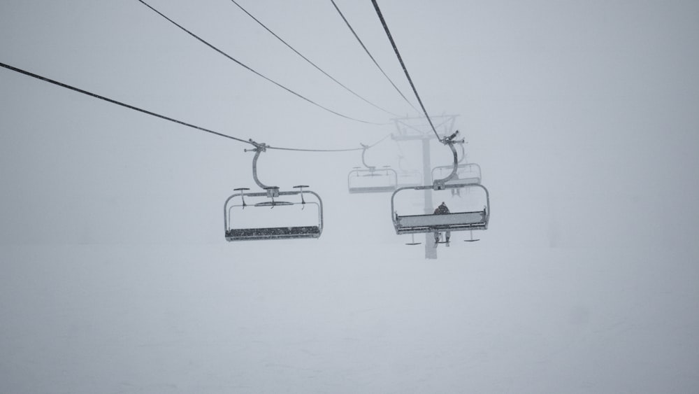 white cable cars on white wall