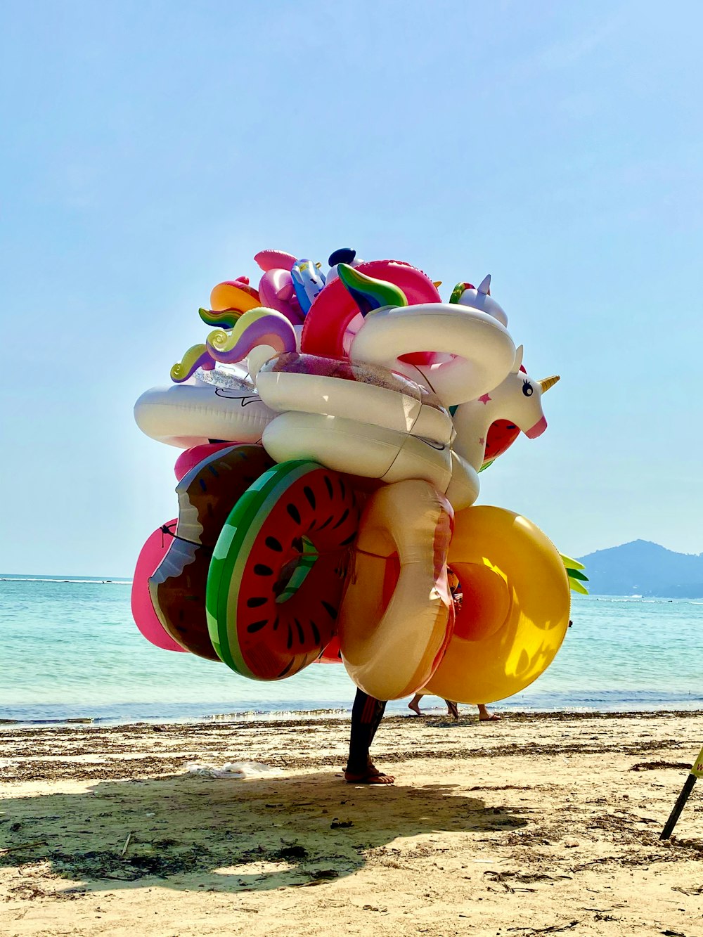 white blue and red inflatable inflatable balloon on beach shore during daytime