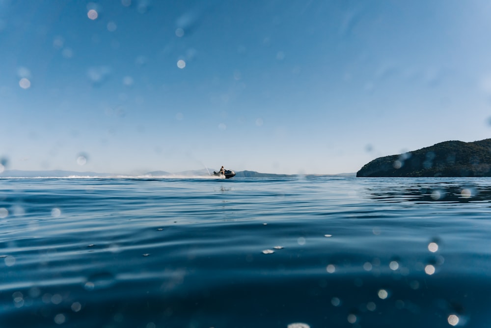 person surfing on sea during daytime