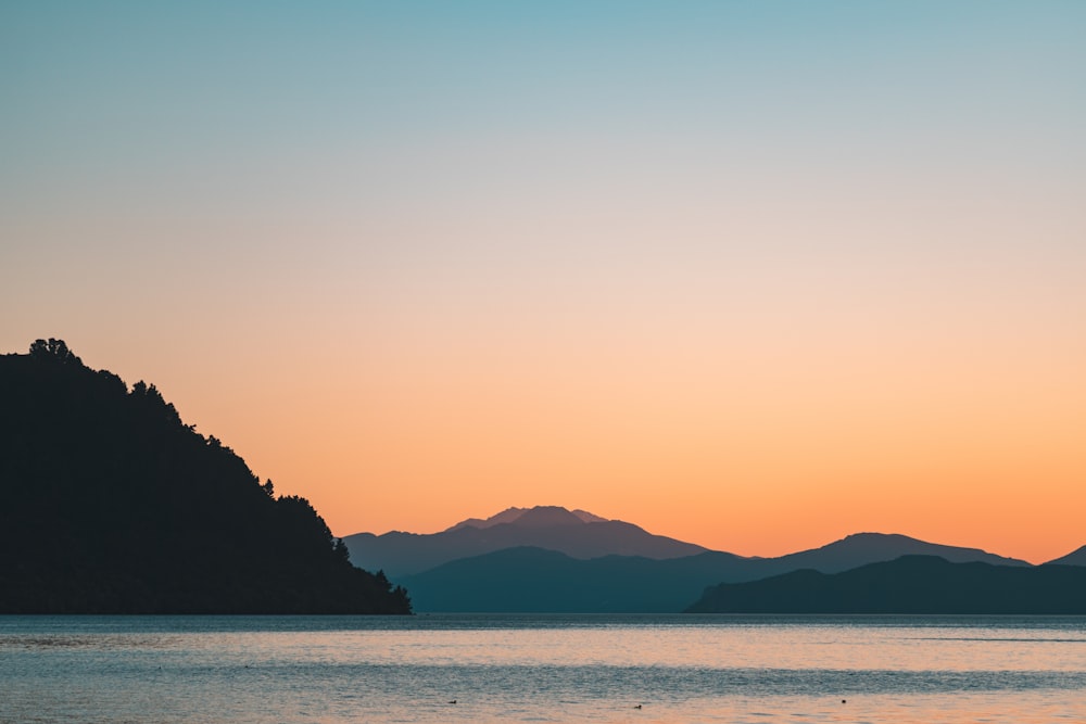 silhouette of mountain during sunset