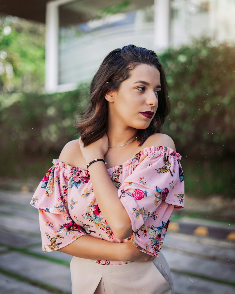 woman in white pink and blue floral dress