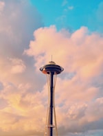 black and white tower under cloudy sky