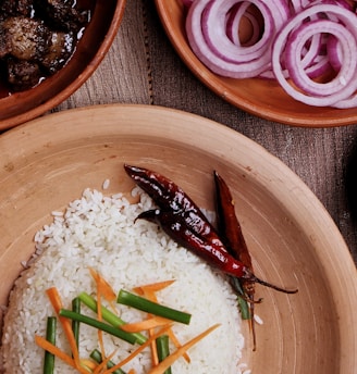 cooked rice on brown wooden bowl