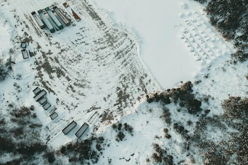 A satellite view showing a fleet of vehicles tracked in real-time on a digital map.