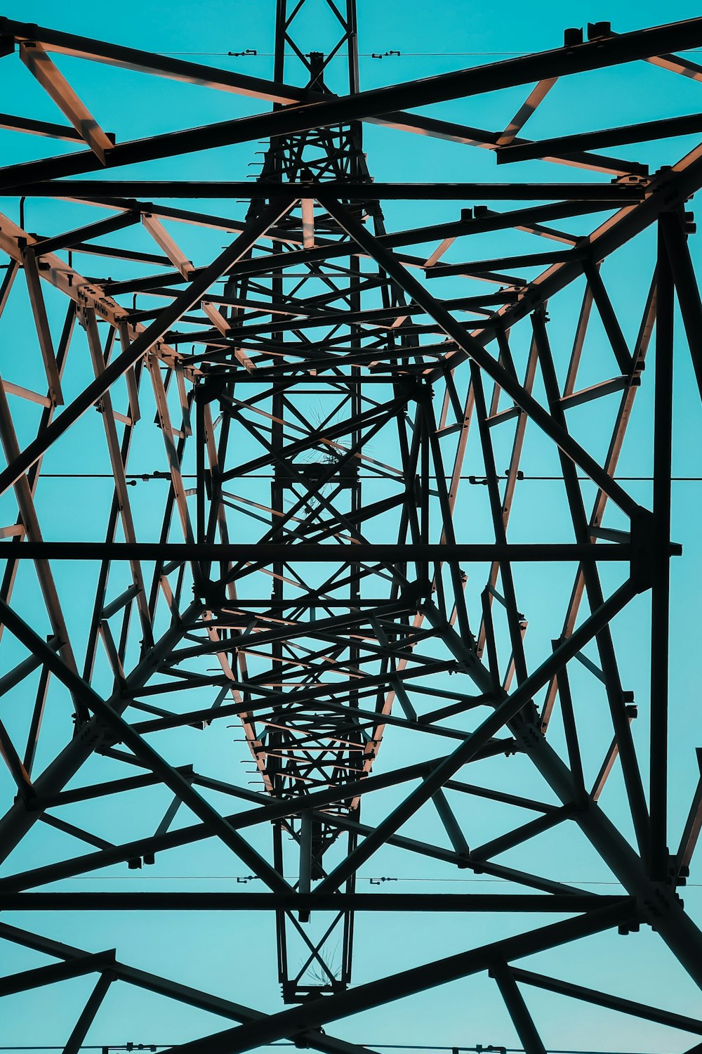 red metal tower under blue sky