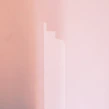 Close-up of a smooth wall freshly painted in a warm, inviting shade.
