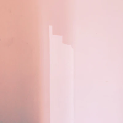 A close-up of a smooth, freshly painted interior wall in a warm, inviting shade.