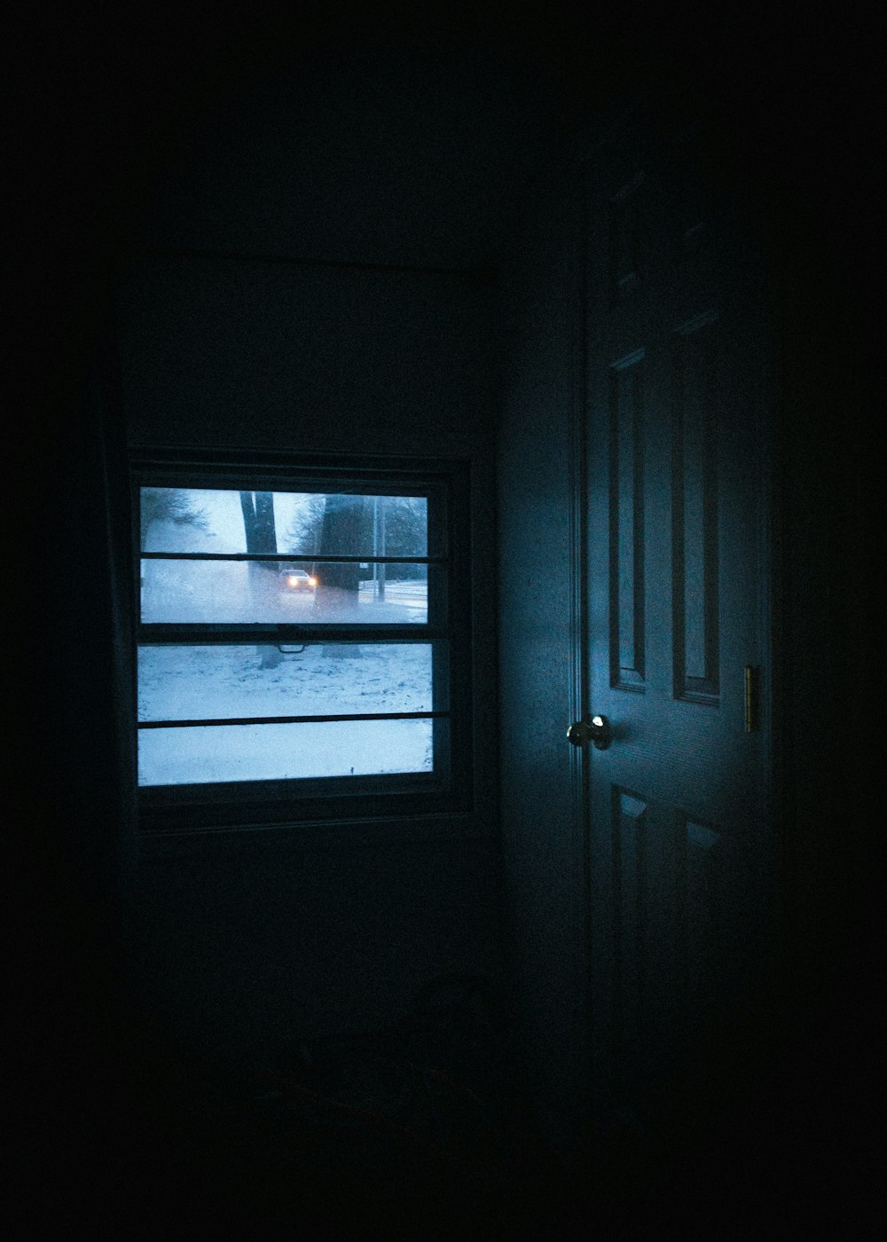 white wooden door with glass