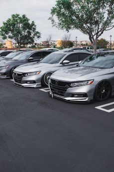 black mercedes benz coupe on parking lot during daytime