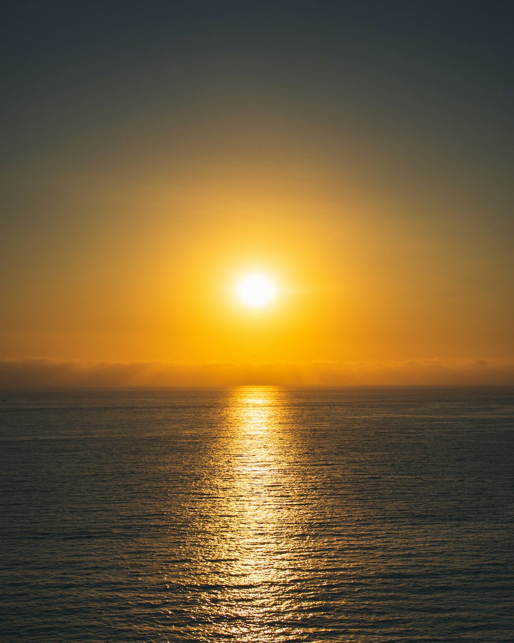 body of water during sunset