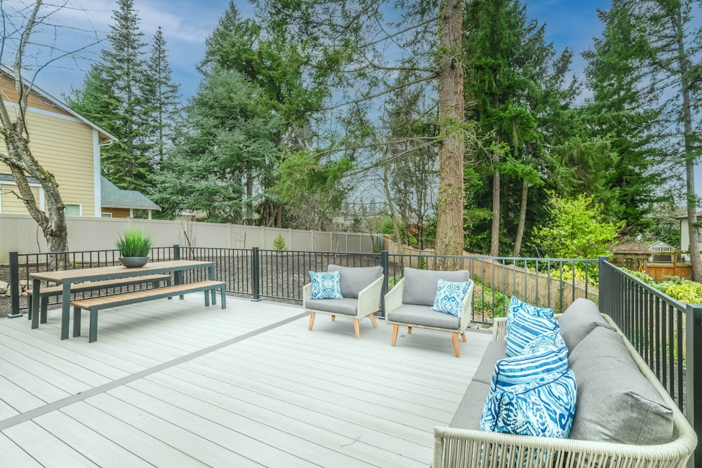 white wooden bench on wooden deck