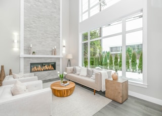 white couch near glass window