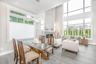 A bright living area in a luxurious Yas Island holiday home featuring modern furniture and large windows.