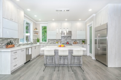 Bright kitchen with stainless steel appliances and island.