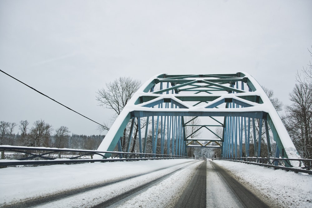 gray metal bridge under white sky during daytime