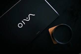 An elegant corporate gift set featuring coasters, mugs, and mouse pads.