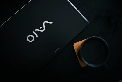 An elegant corporate gift set featuring coasters, mugs, and mouse pads.