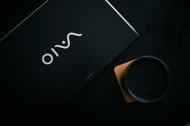 Close-up of premium promotional merchandise including custom mugs and tech accessories with subtle branding.