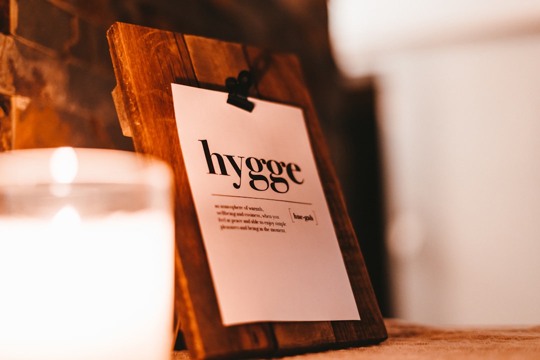 brown wooden frame with white and black love print, hygge.