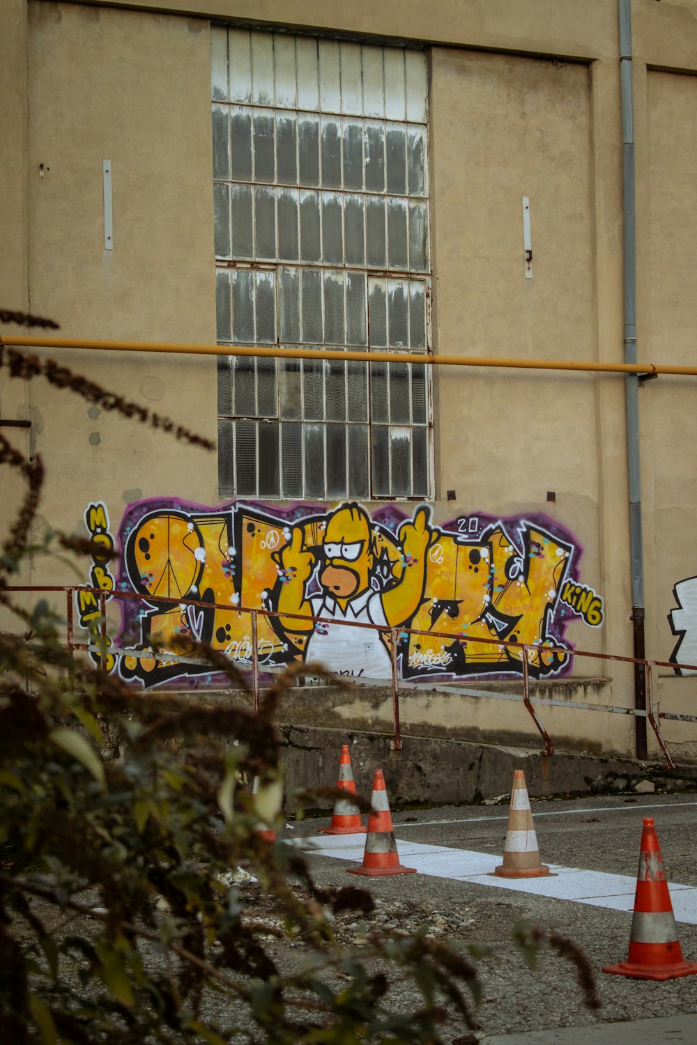 yellow and black graffiti on wall