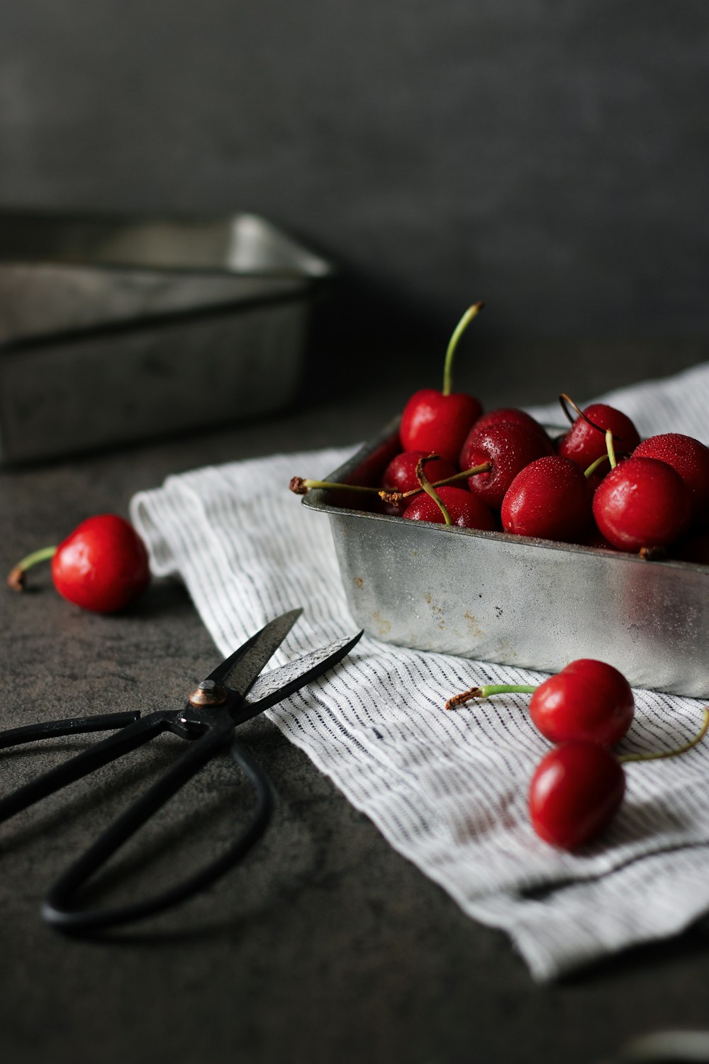 red cherries on white paper