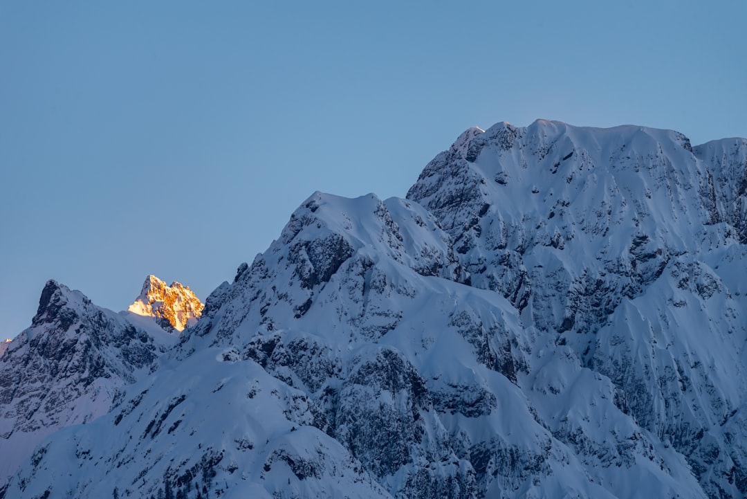 snow covered mountain during daytime