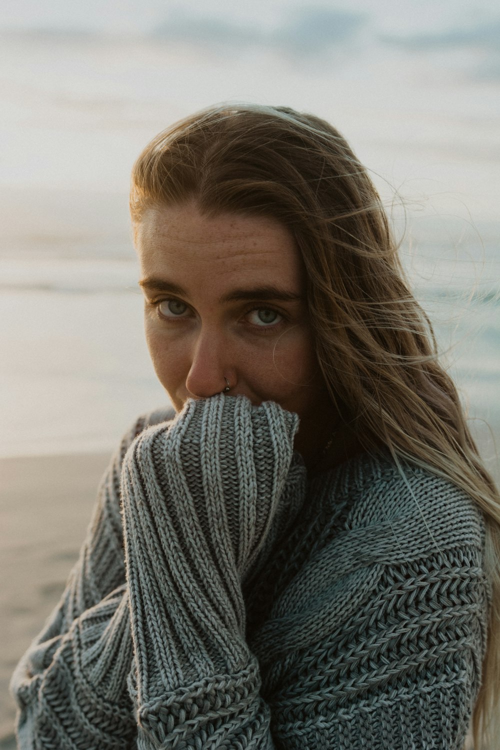 woman in gray knit sweater