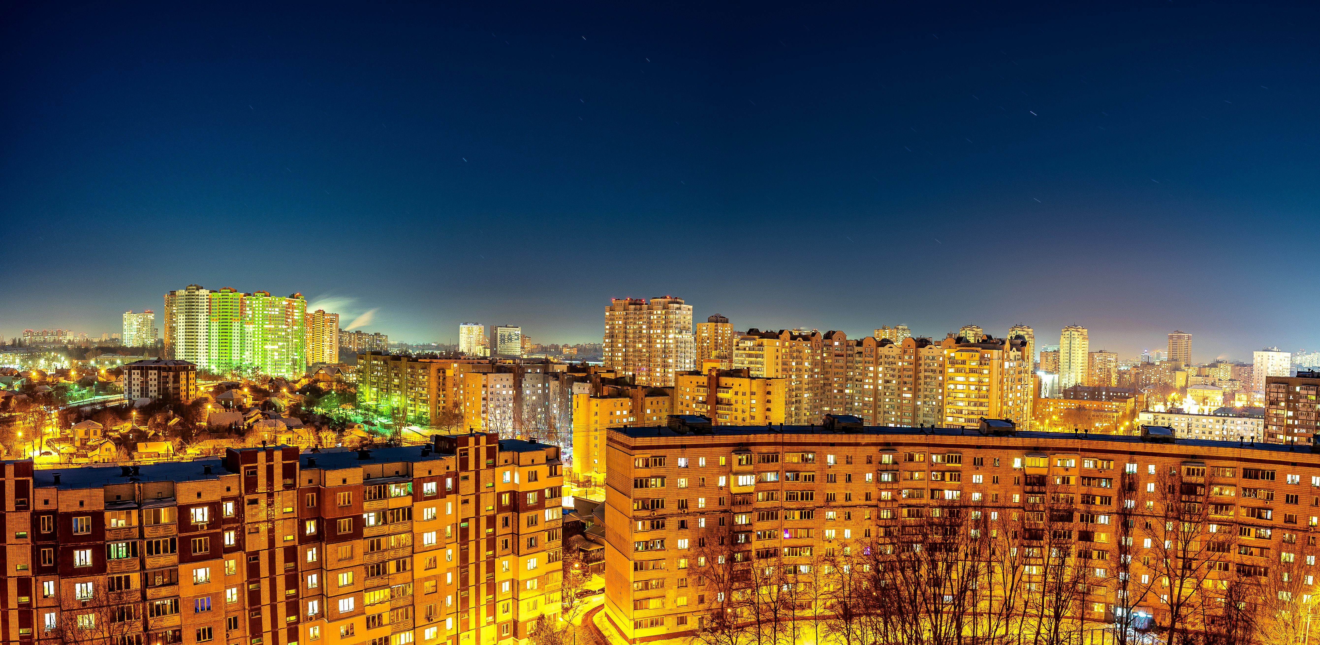 city lights turned on during night time