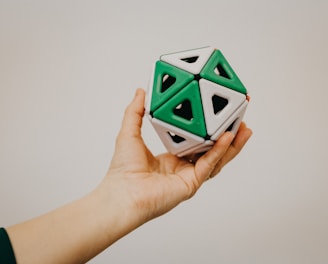 white and green ceramic cube