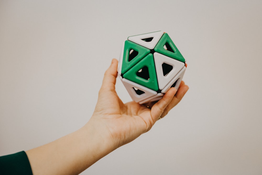 white and green ceramic cube