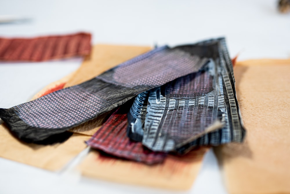 brown and black textile on brown wooden table