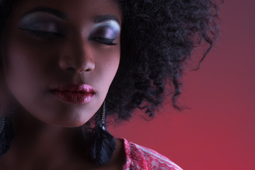 woman in red and white shirt