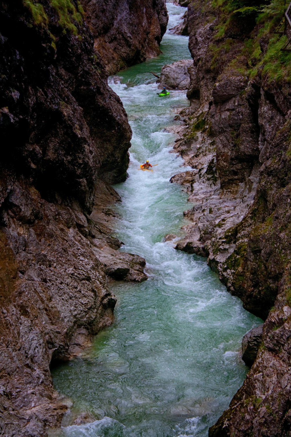 river between rocky mountain during daytime