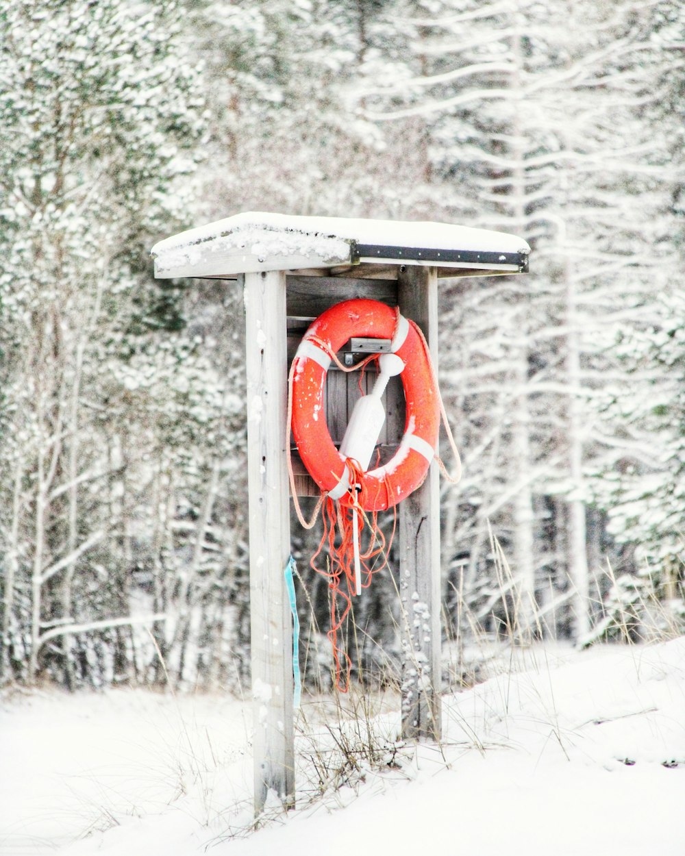 red and white wooden hanging bell