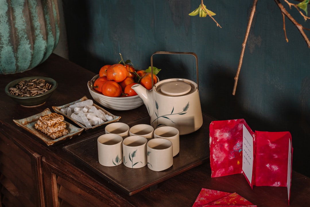 white ceramic mugs on brown wooden table, Vietnamese</p>
<p>Vietnam</p>
<p>Lunar New Year</p>
<p>Tea Set</p>
<p>Gathering</p>
<p>Lucky</p>
<p>Red</p>
<p>New Year</p>
<p>