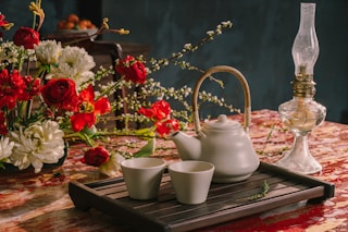 white ceramic teapot on brown wooden tray
