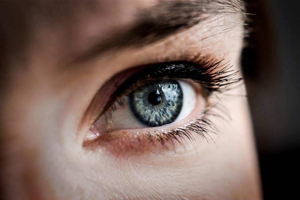 persons eye in close up photography