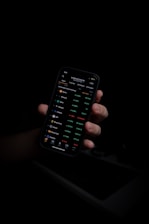 person holding black iphone 5
