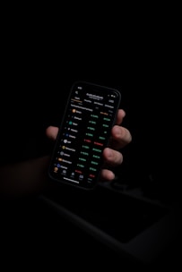 person holding black iphone 5