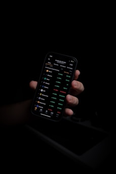 person holding black iphone 5