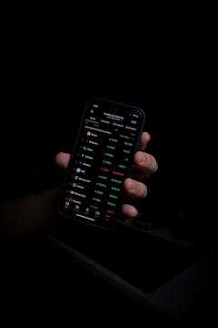 person holding black iphone 5