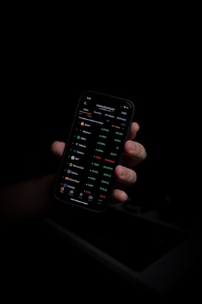person holding black iphone 5