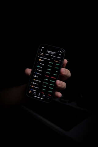 person holding black iphone 5
