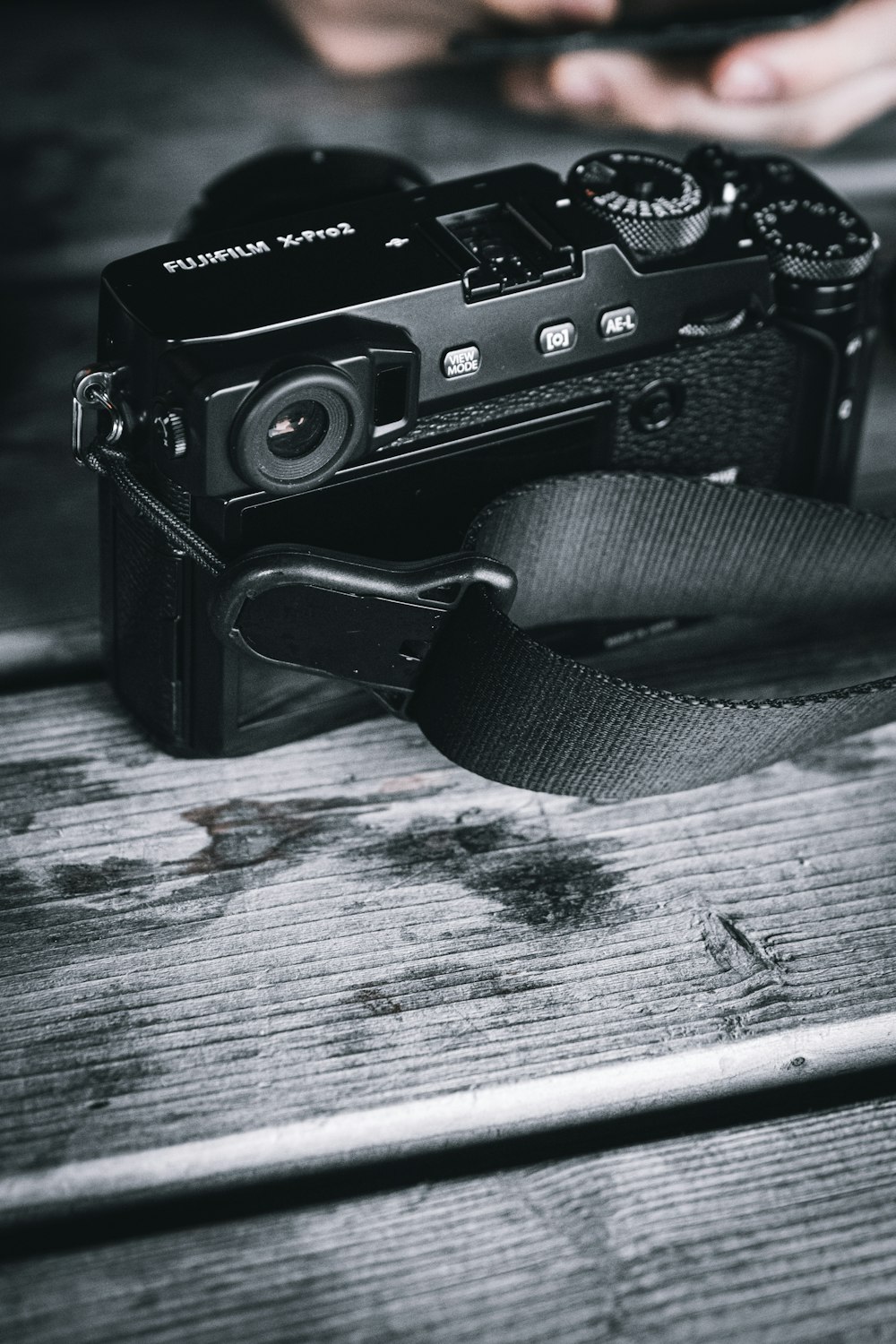 black nikon dslr camera on white wooden table