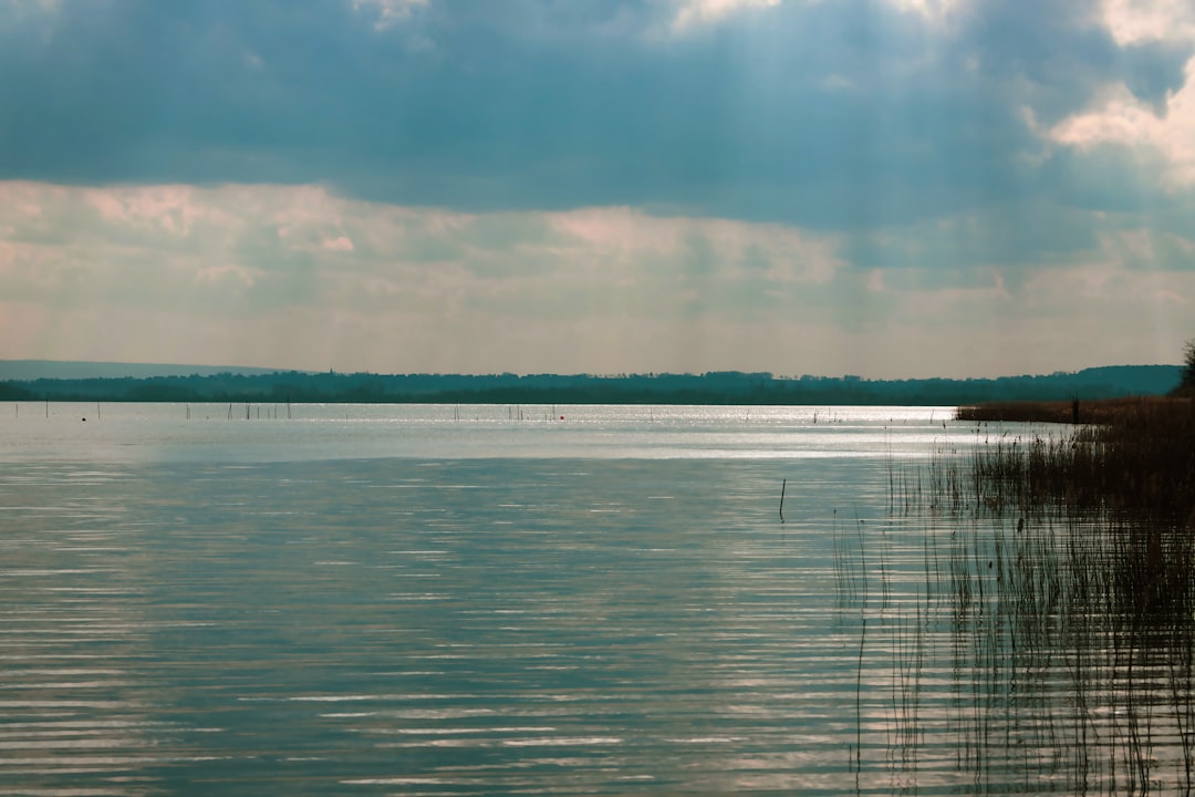 body of water under blue sky during daytime