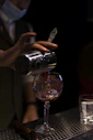 person holding clear wine glass