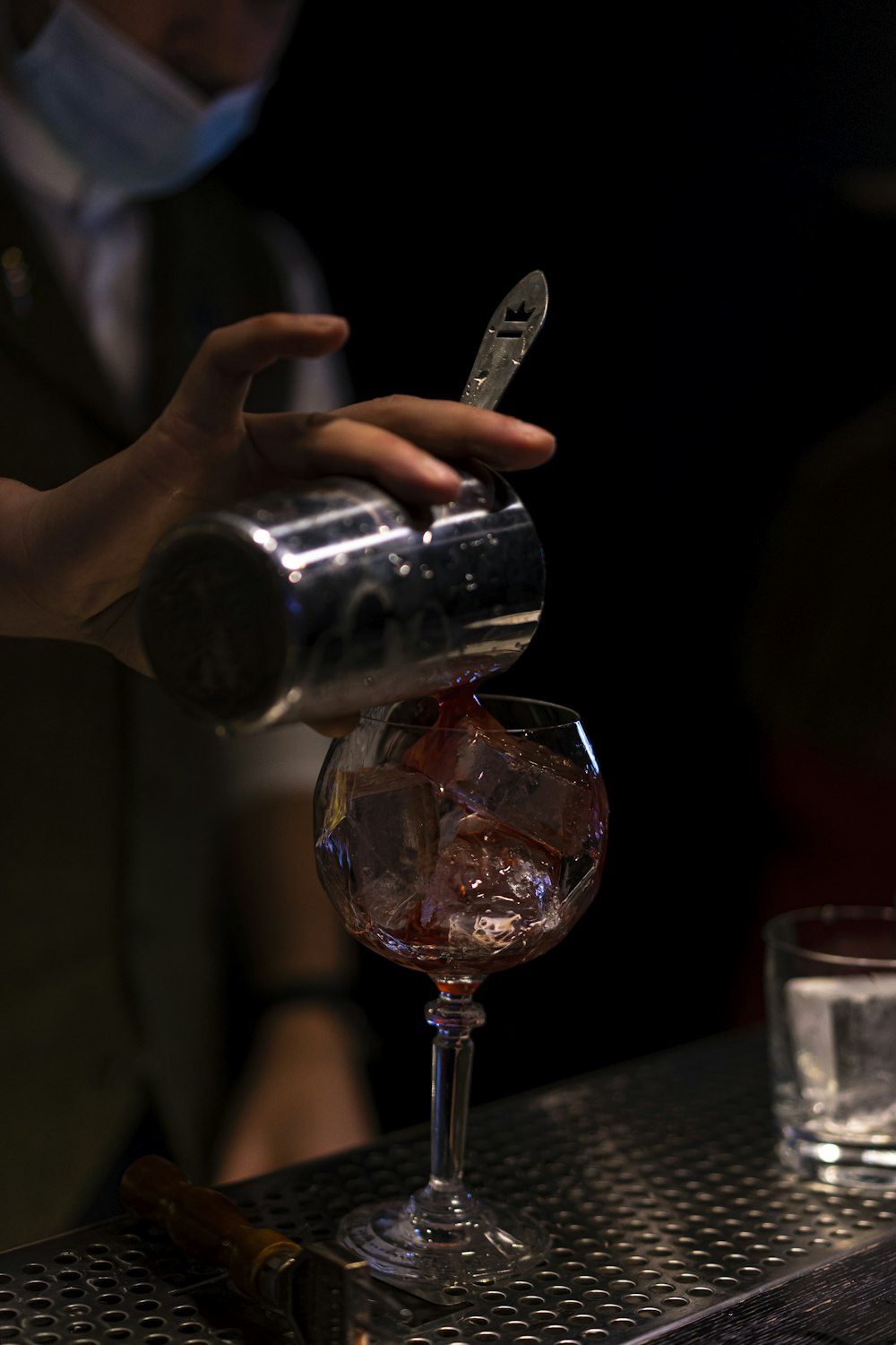 person holding clear wine glass