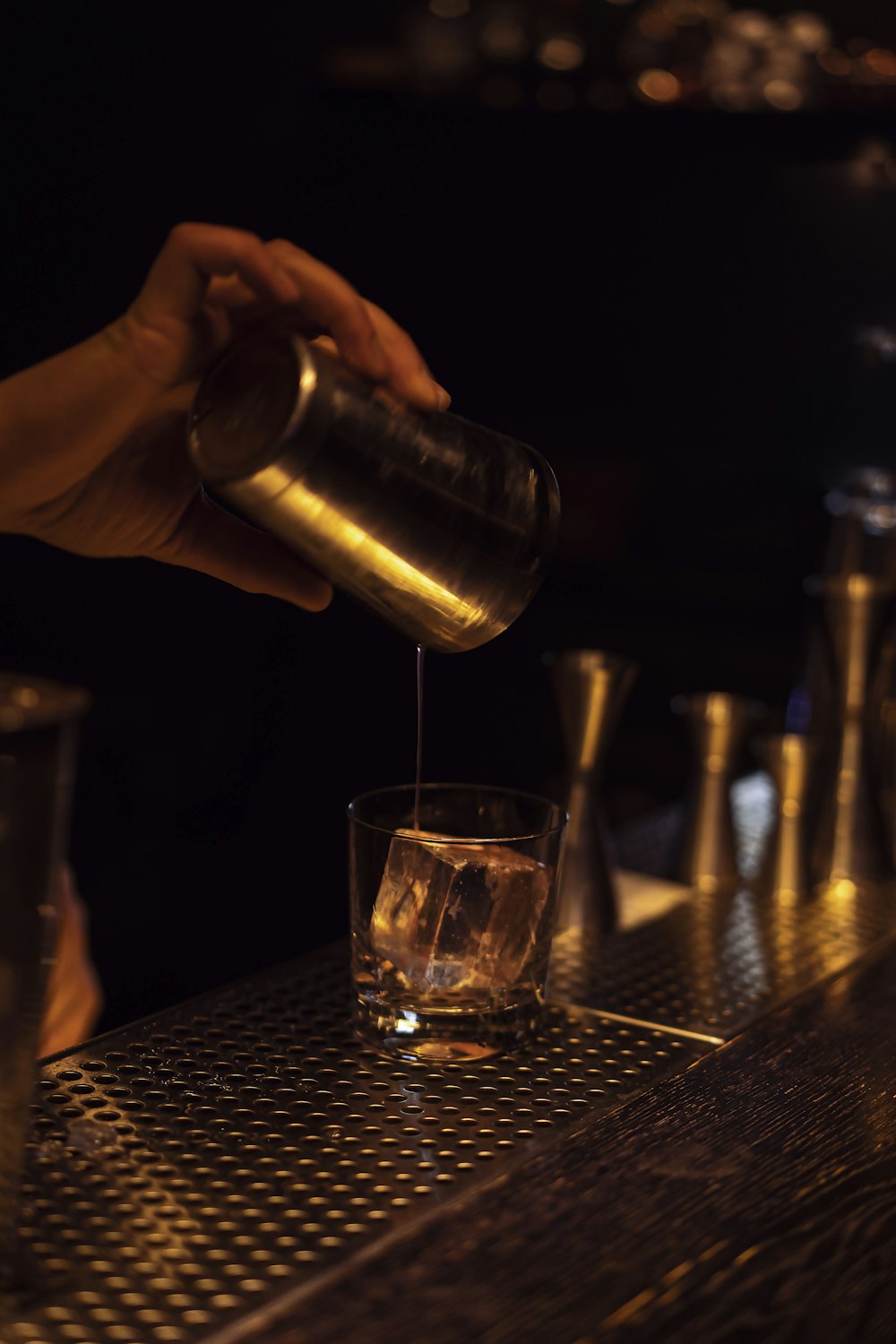 person holding clear drinking glass