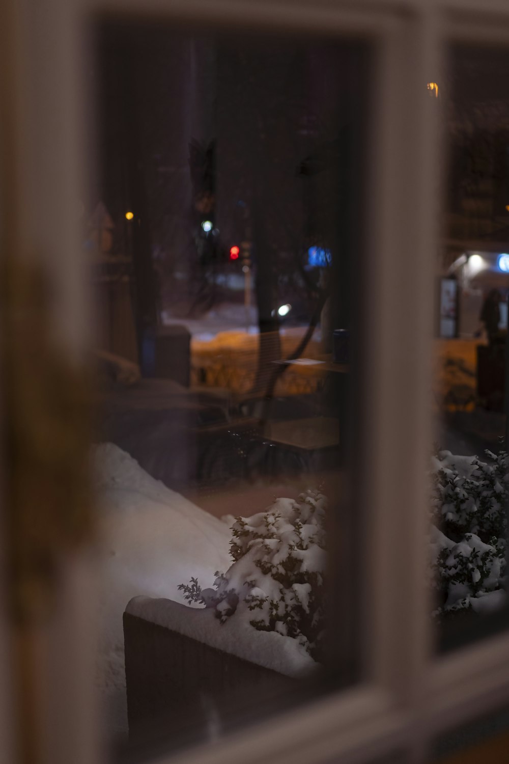 white car parked on the side of the road during night time