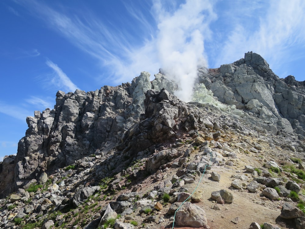 gray rocky mountain under blue sky during daytime